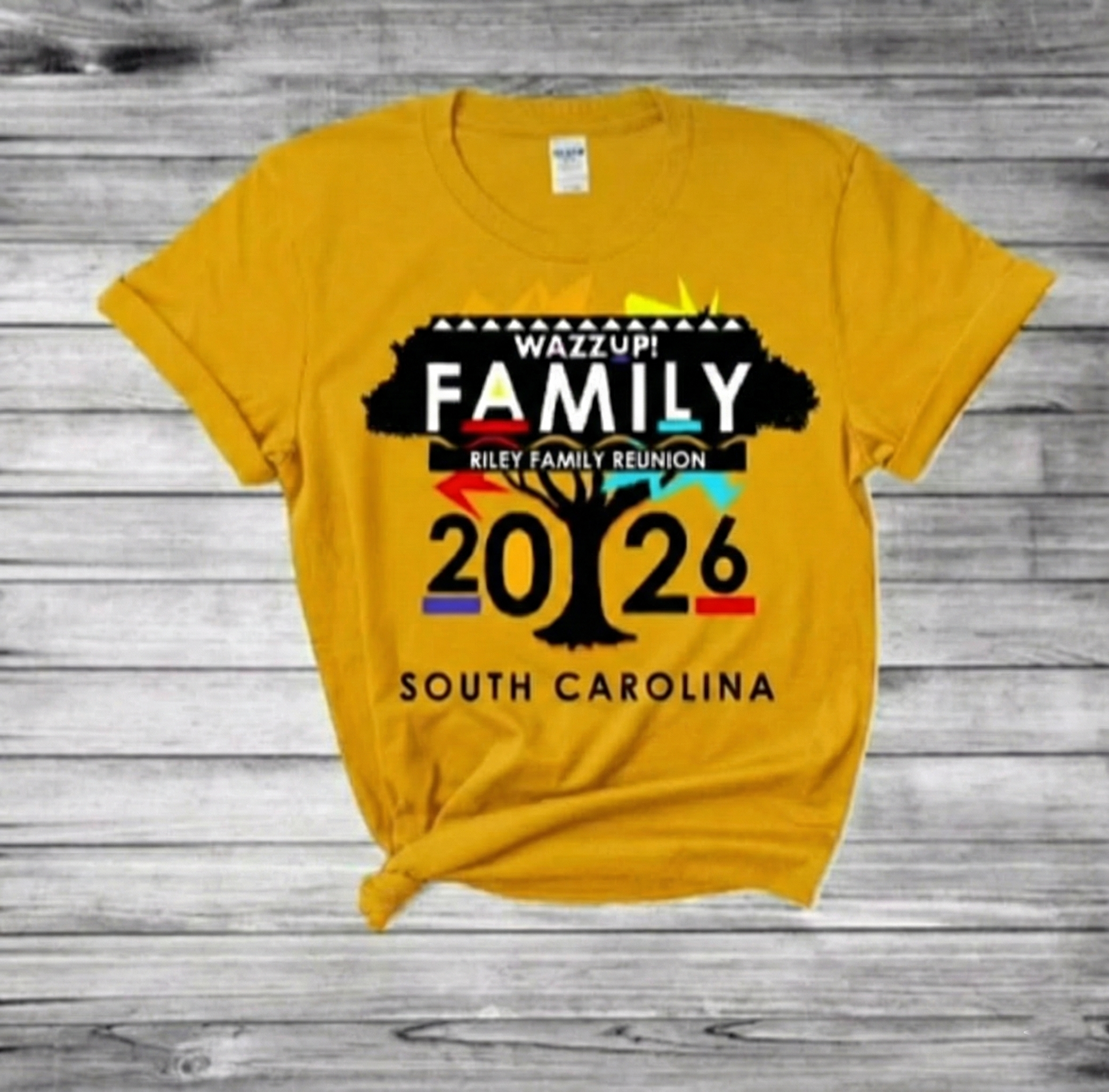 Riley Family Reunion 2026 Official T-Shirt - Gold shirt with WAZZUP! FAMILY design featuring family tree